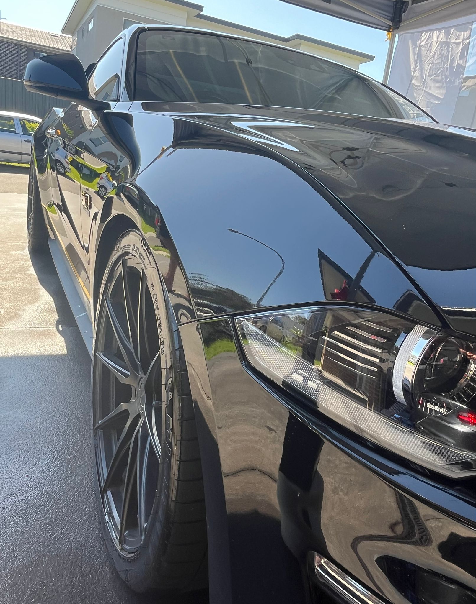 Black sports car with mirror finish ceramic coating