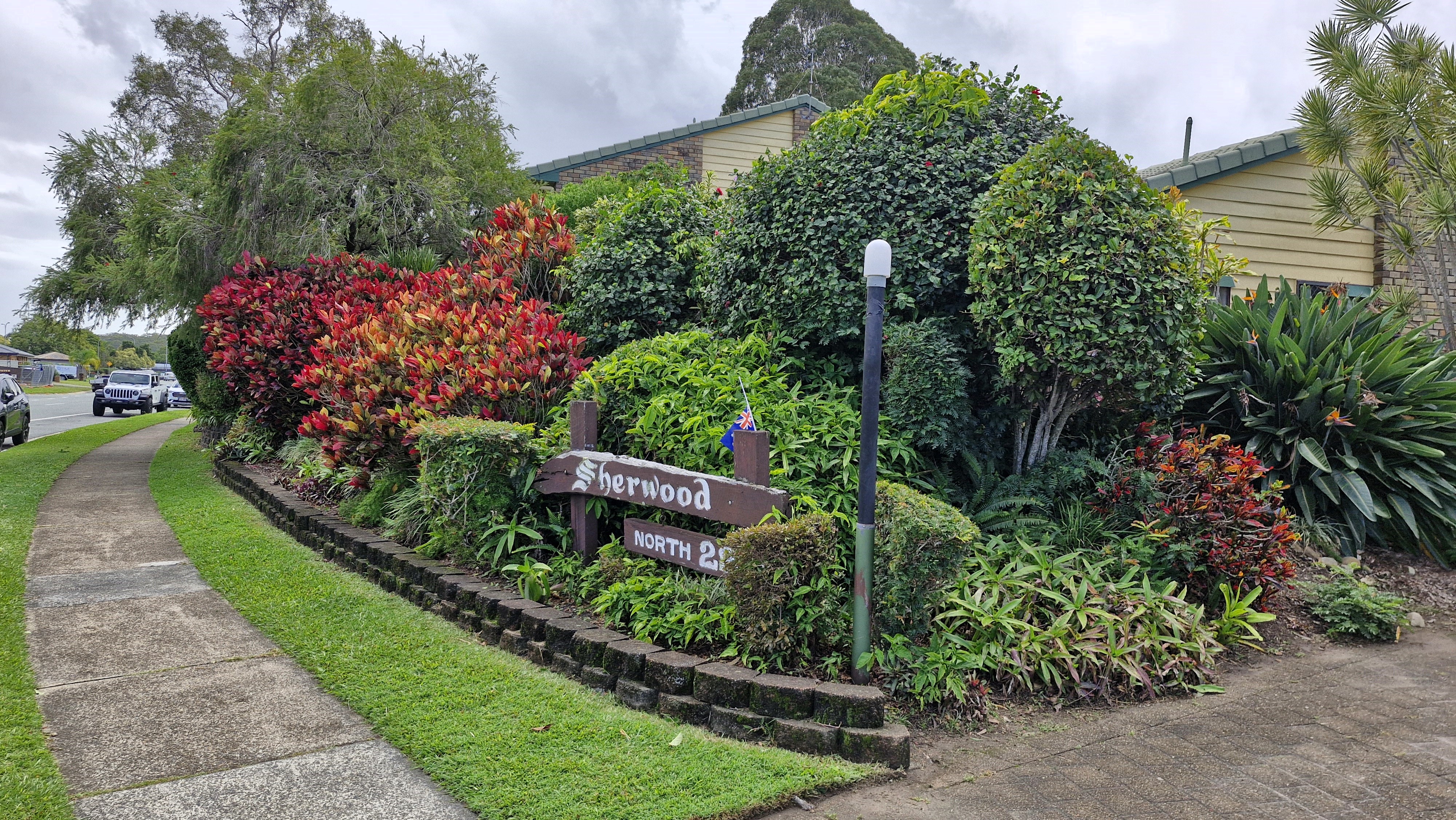 Well-maintained garden bed with colourful shrubs at Sherwood North