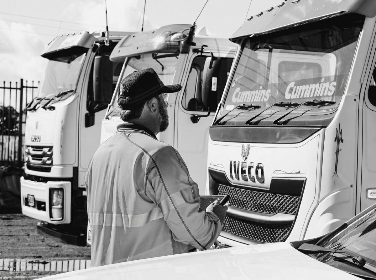 Safety Certificate Centre inspector reviewing vehicles at a truck depot