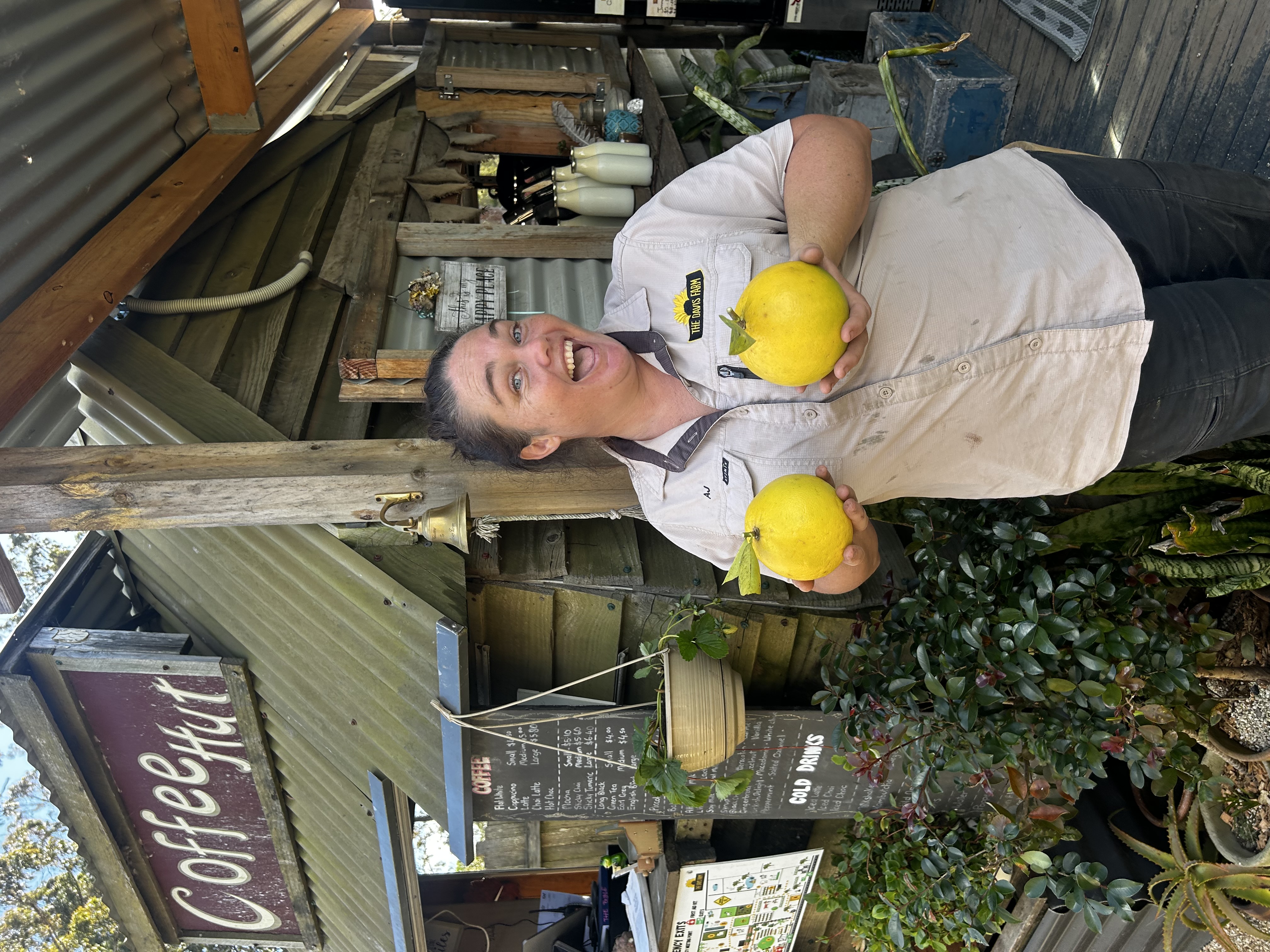 Aj at the Coffee Hut with fresh farm produce