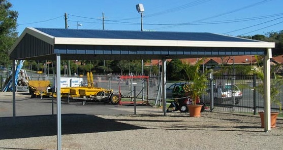Open steel carport with a low-pitch gable roof