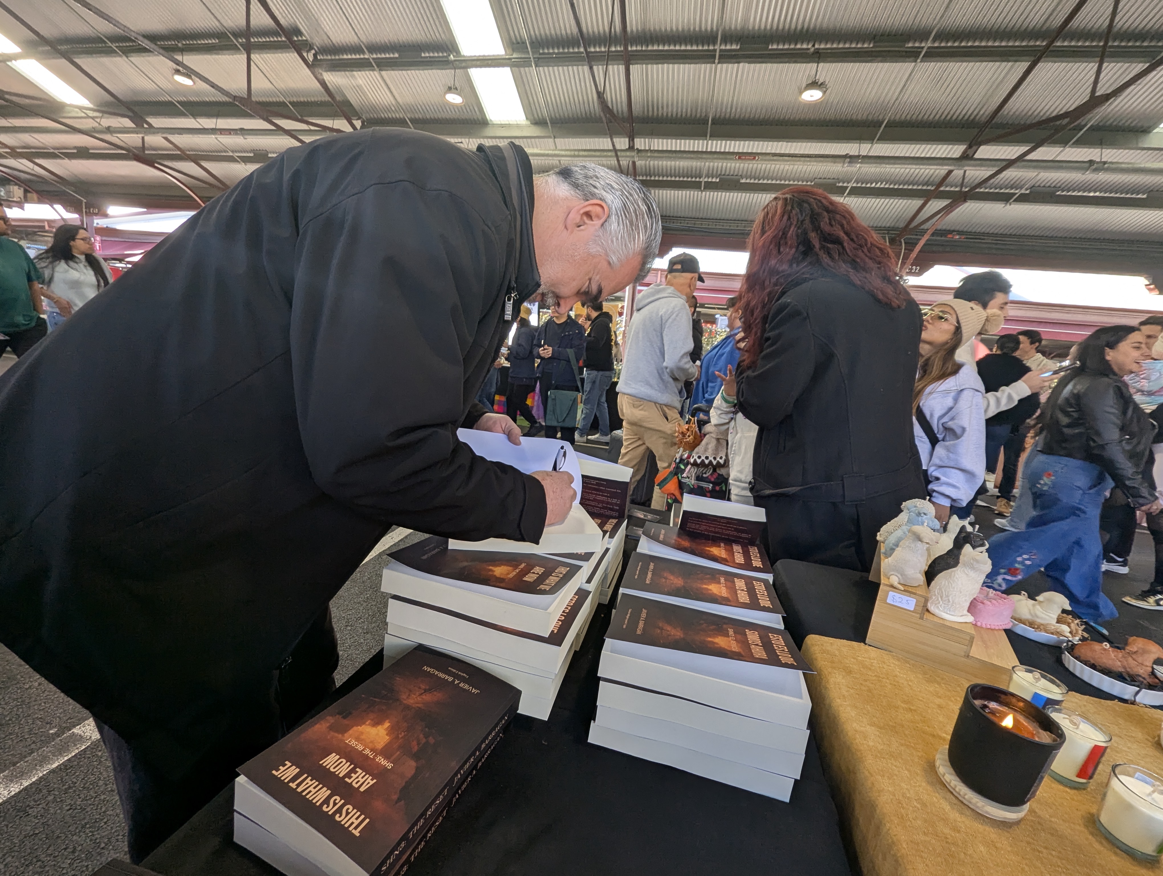 Signing books at Cachivaches