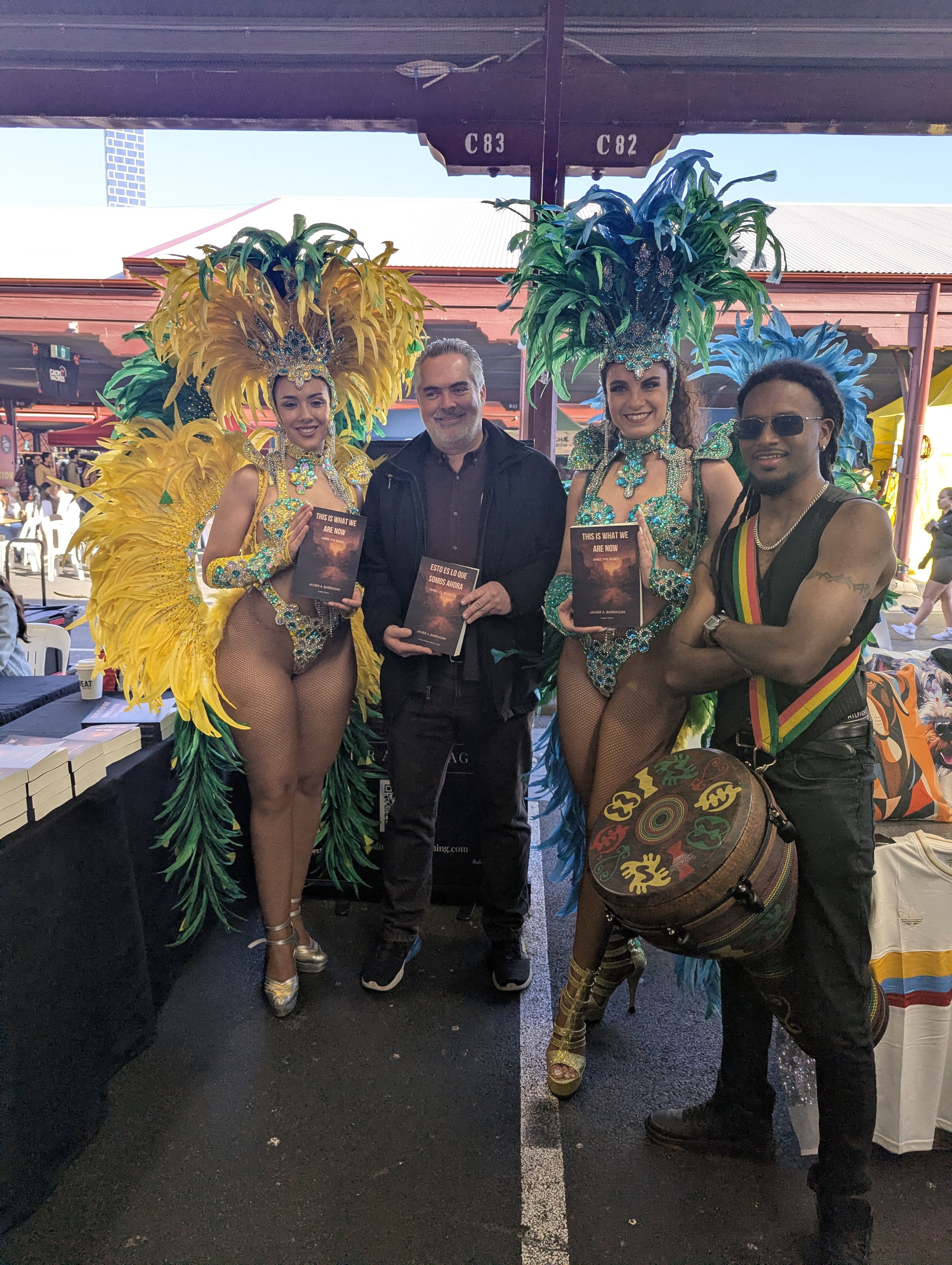 With carnival performers holding books