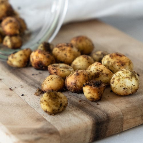 Roasted macadamia nuts with lemon myrtle on wooden board