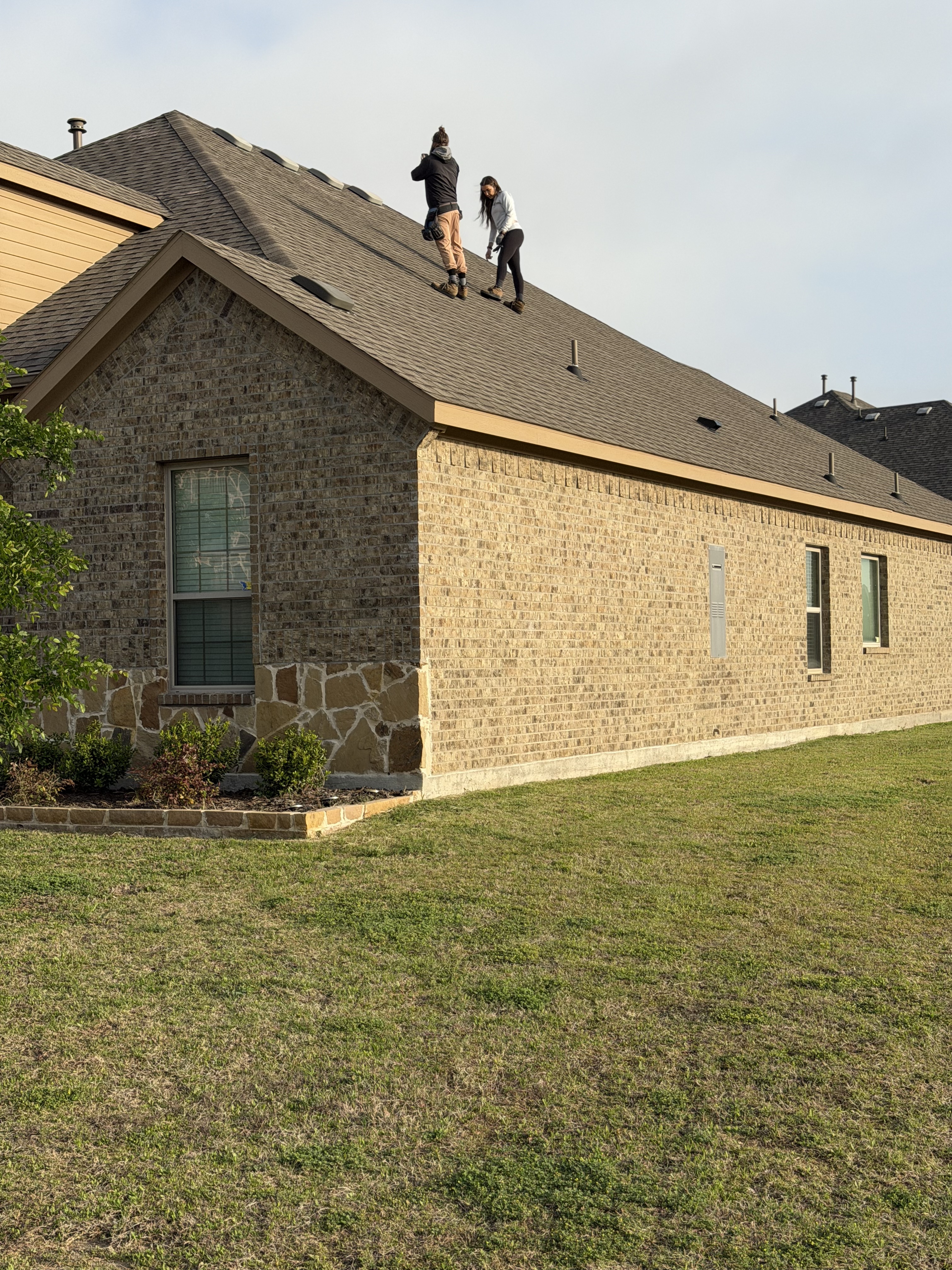 Strong Bond Roofing crew performing a residential roof replacement in DFW
