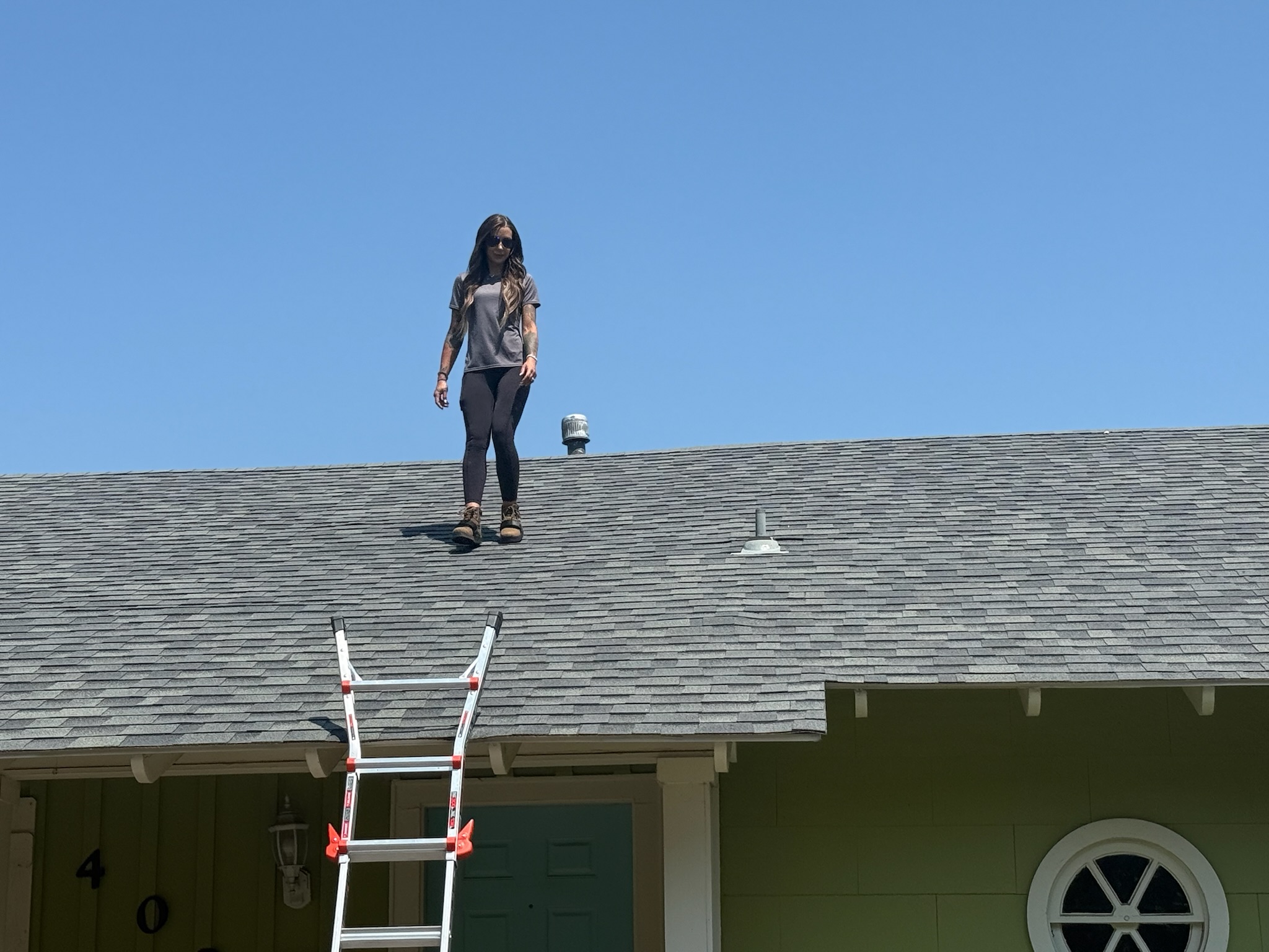 Taylor Thorne personally walking on a residential roof during a storm damage inspection in Dallas-Fort Worth