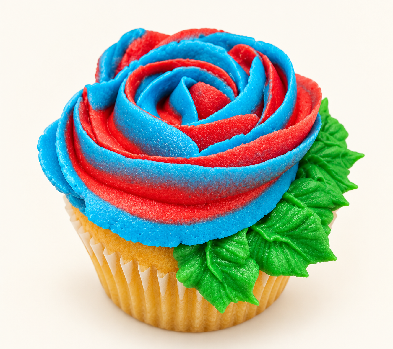 Rose swirl cupcake in blue and red with green leaf piping
