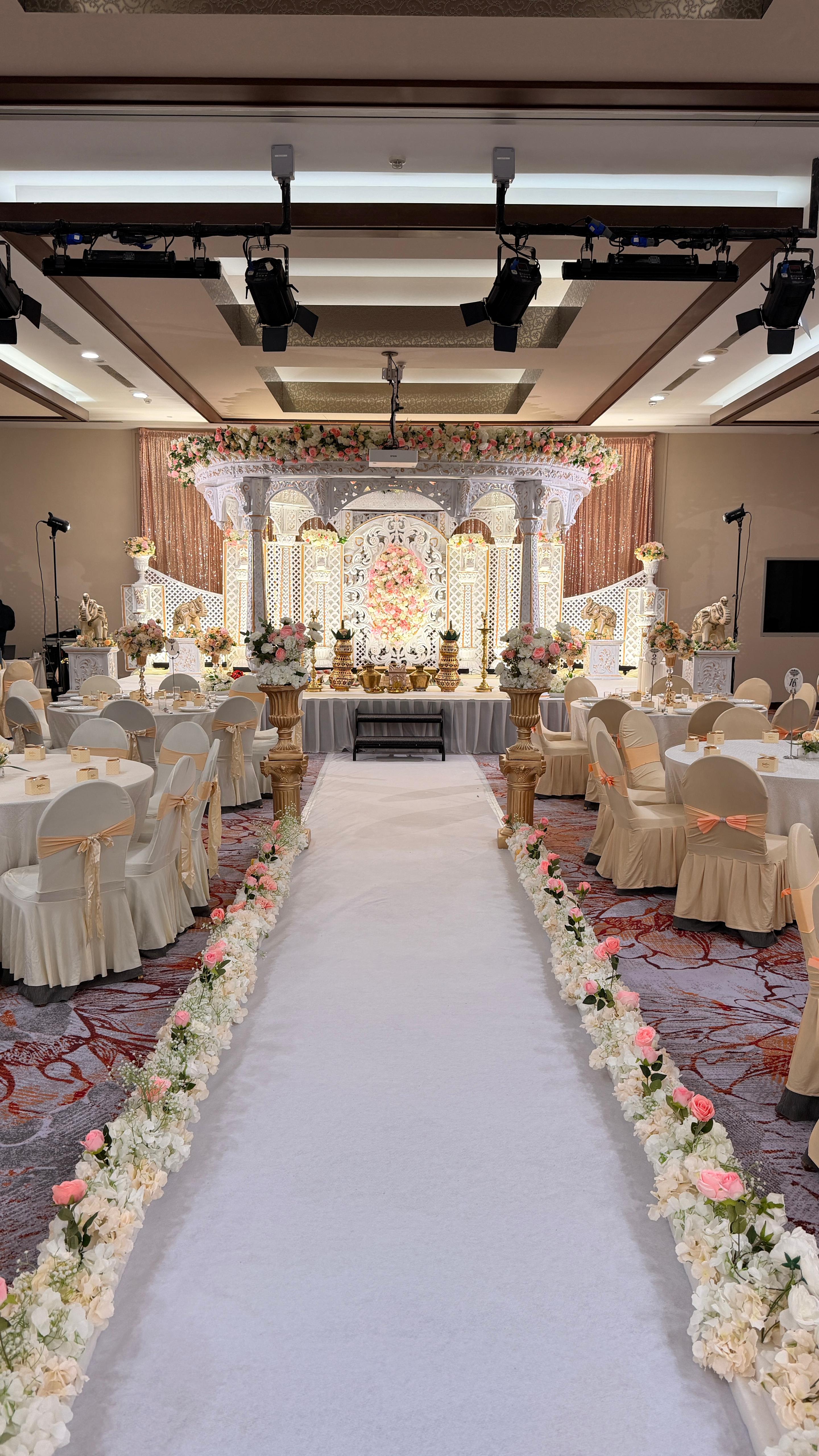 Serangoon Gardens Country Club aisle with floral decorations and mandap view