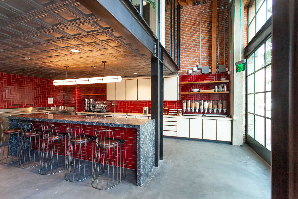 Custom commercial cabinetry with HPL and solid walnut edgebanding for Newco in Los Angeles CA by California Woodworking