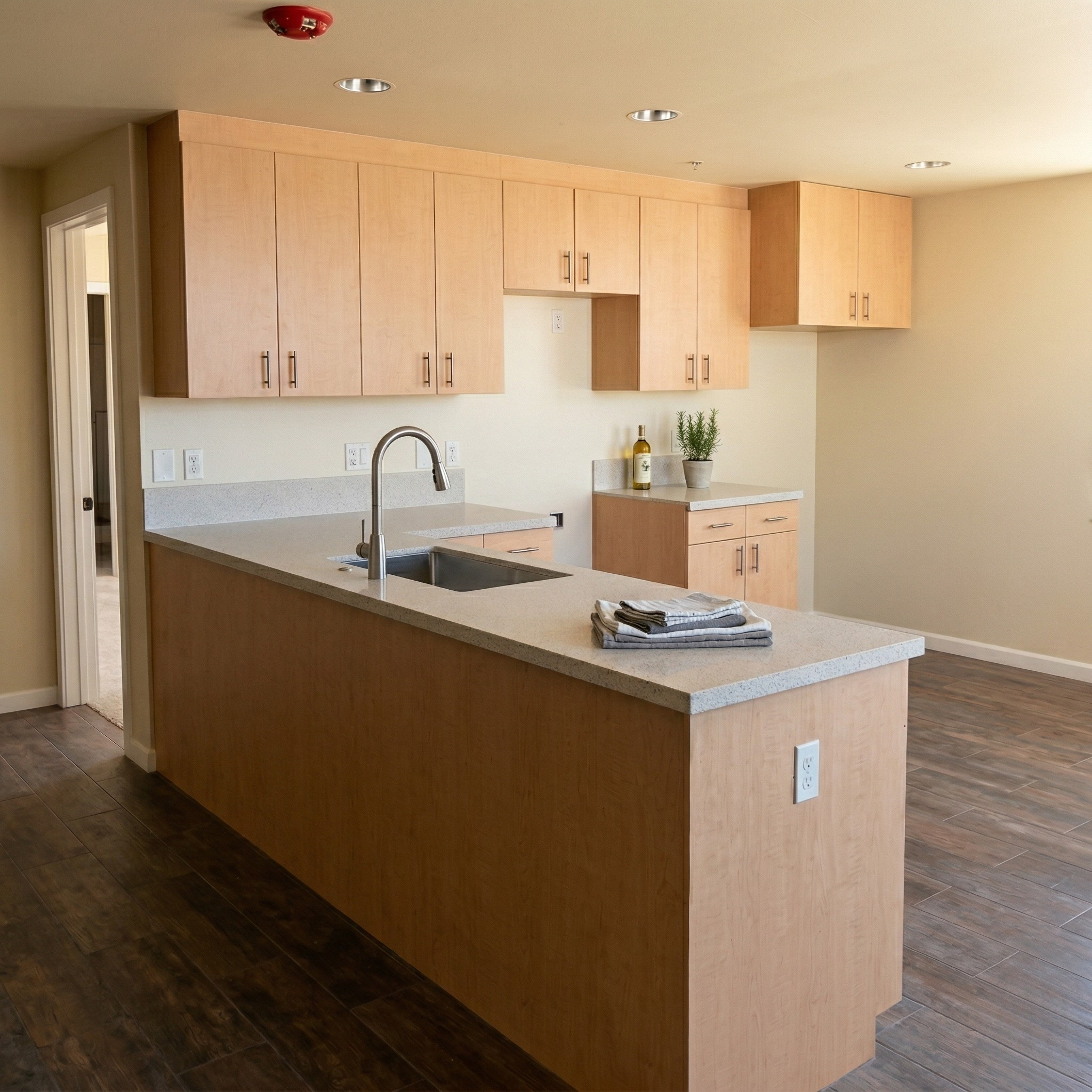 Storage facility residence kitchen with Wilsonart acrylic solid surface countertops and high-pressure plastic laminate cabinets in Oxnard CA