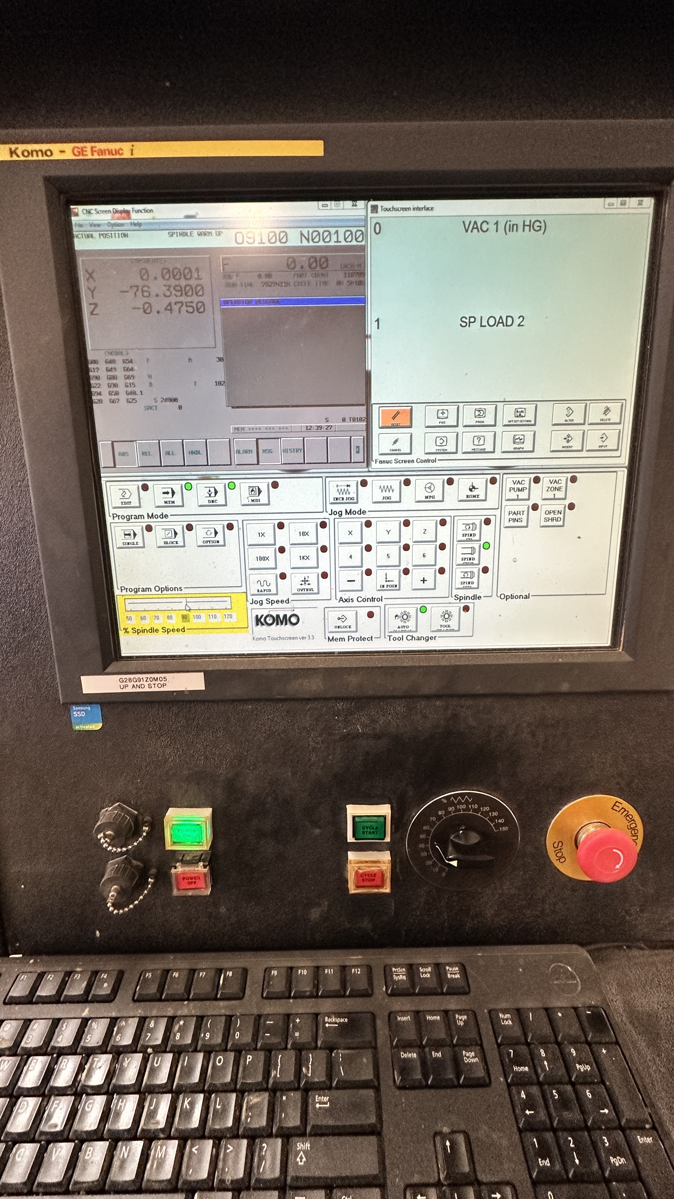 KOMO GE Fanuc i CNC control panel showing live machine position data